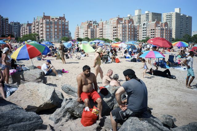 people enjoying a day at Brighton Beach